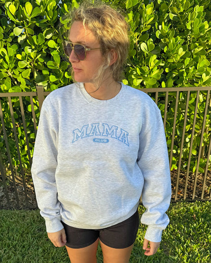 Mama Club embroidered crewneck in heather grey with dusty blue MAMA CLUB embroidery, worn outdoors