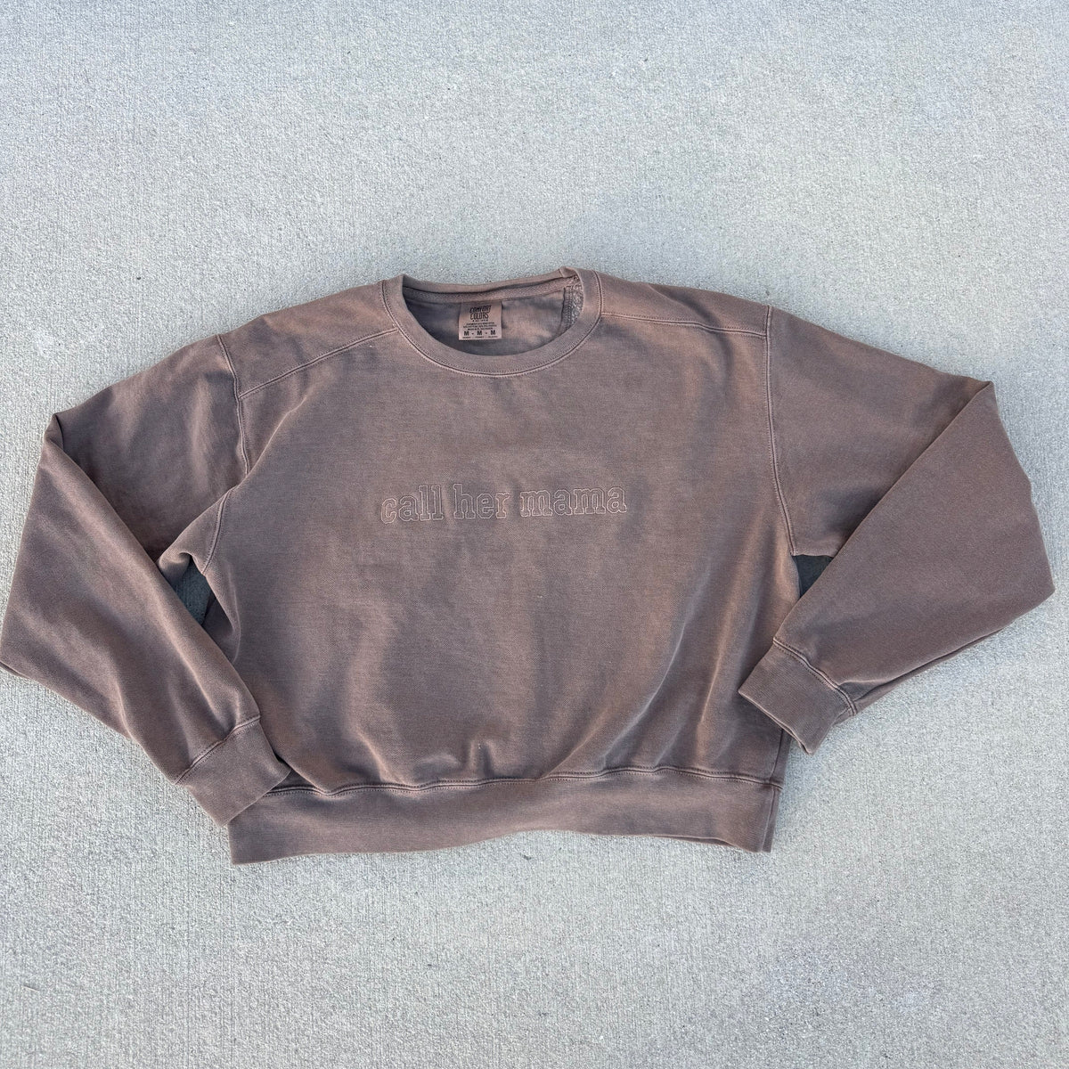 Espresso embroidered crop crewneck, photographed flat on stone from the Call Her Mama photoshoot