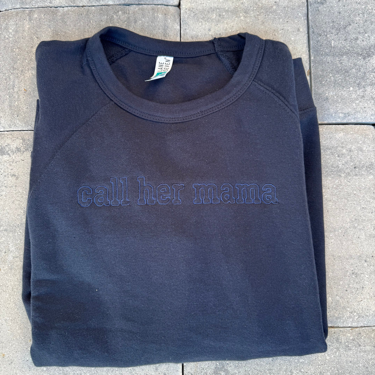 Navy Call Her Mama embroidered crewneck, photographed flat on stone from the Call Her Mama photoshoot